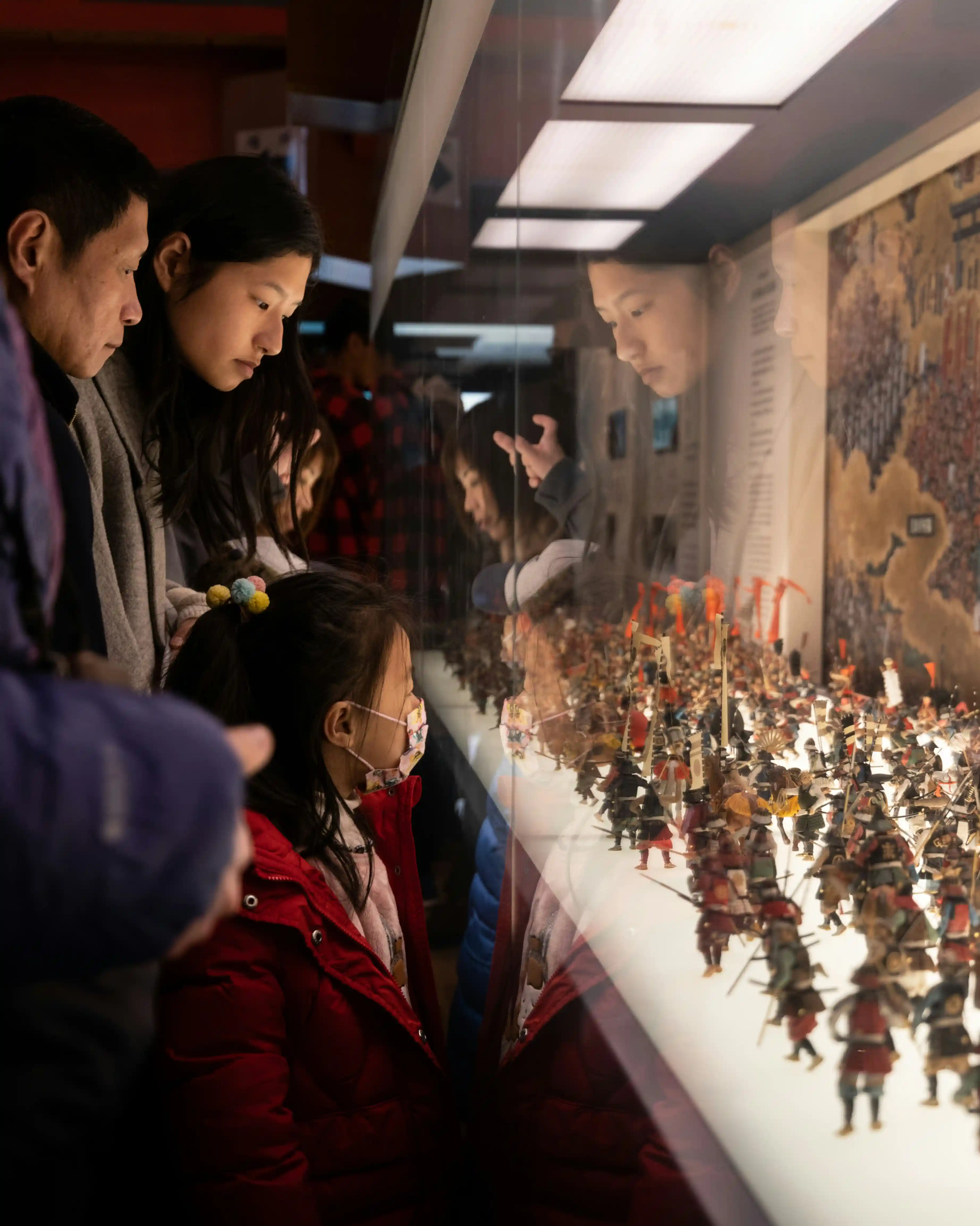 Families exploring the museum at night